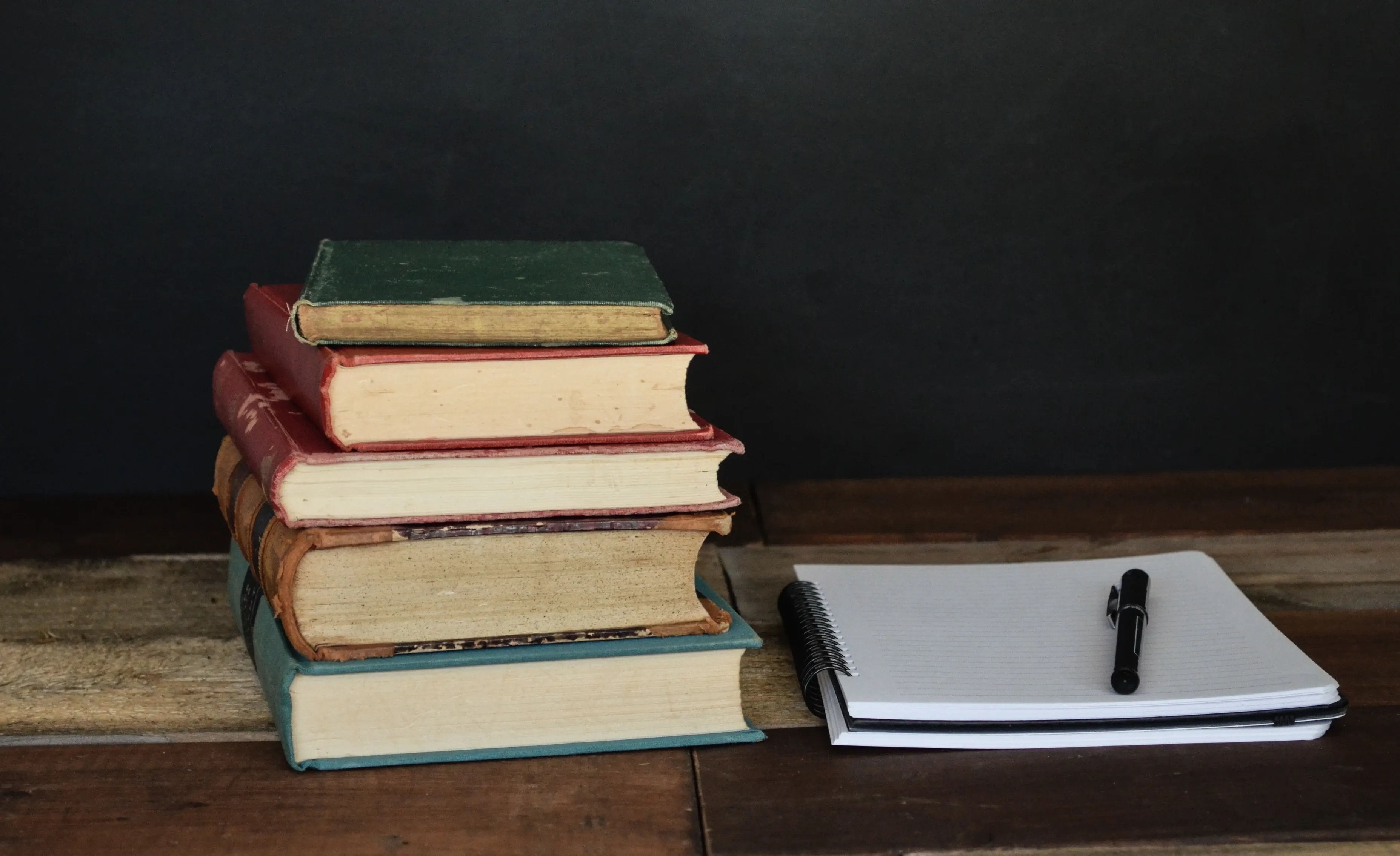 Everything You Need to Know About Becoming a Visiting Scholar Featured Image: Photo of books and Notebook