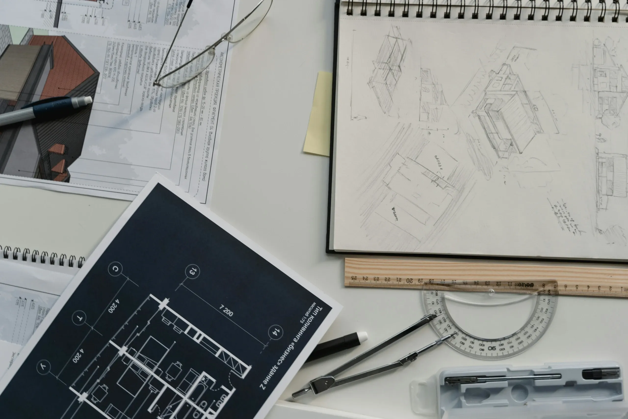 Picture of architecture notebook and sketches, measurement tools; photo by: Photo by Tima Miroshnichenko